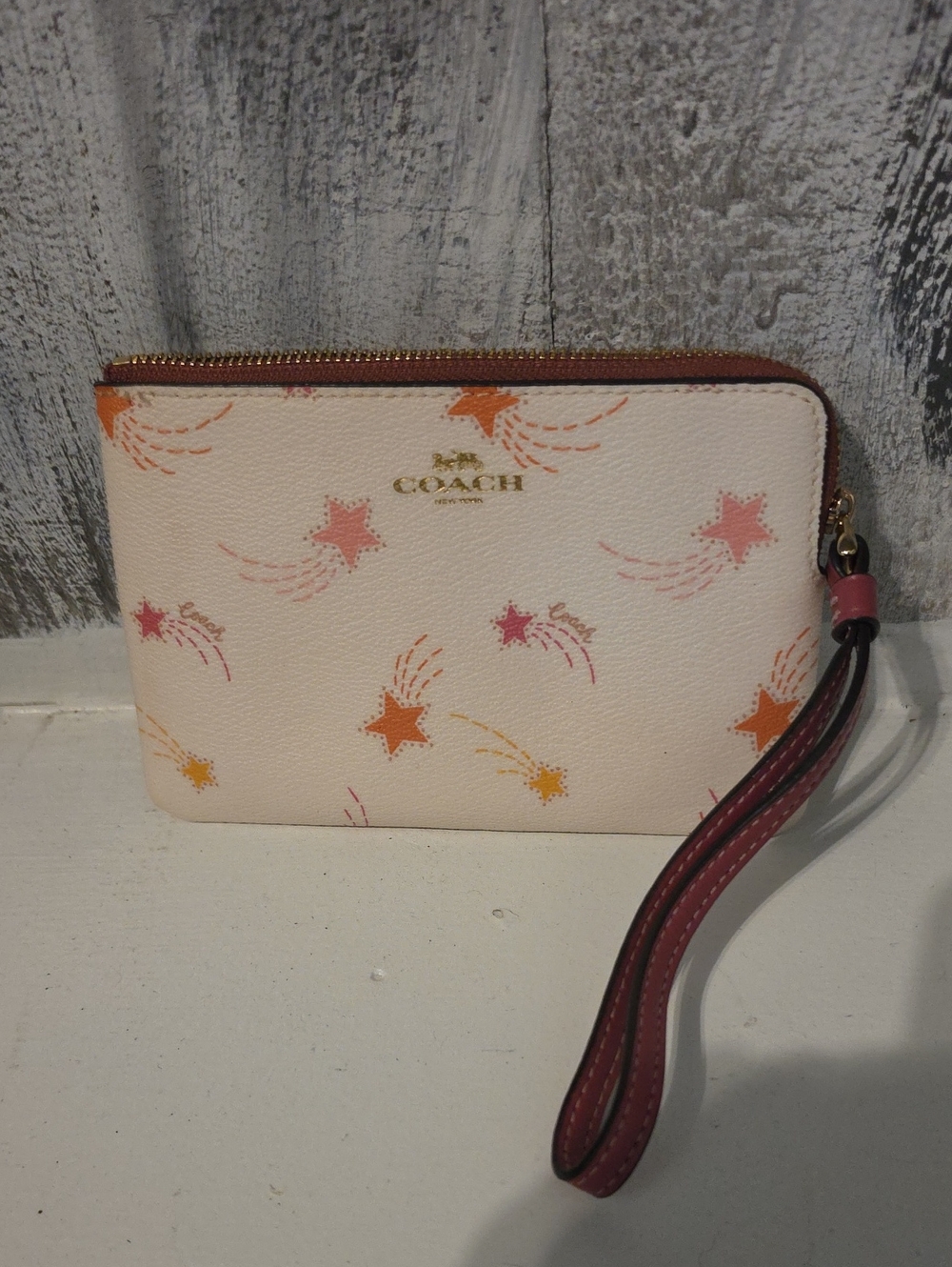 Coach Cream Wristlet with Pink & Orange Star Motif